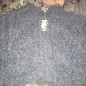 A baby blue wool blend knit sweater